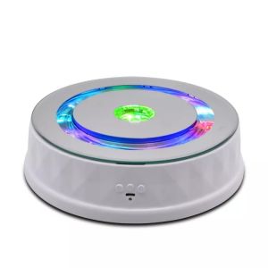 China Multifunction Automatic Rotating Stand Bluetooth Speaker Musical Electric Display Stand wholesale