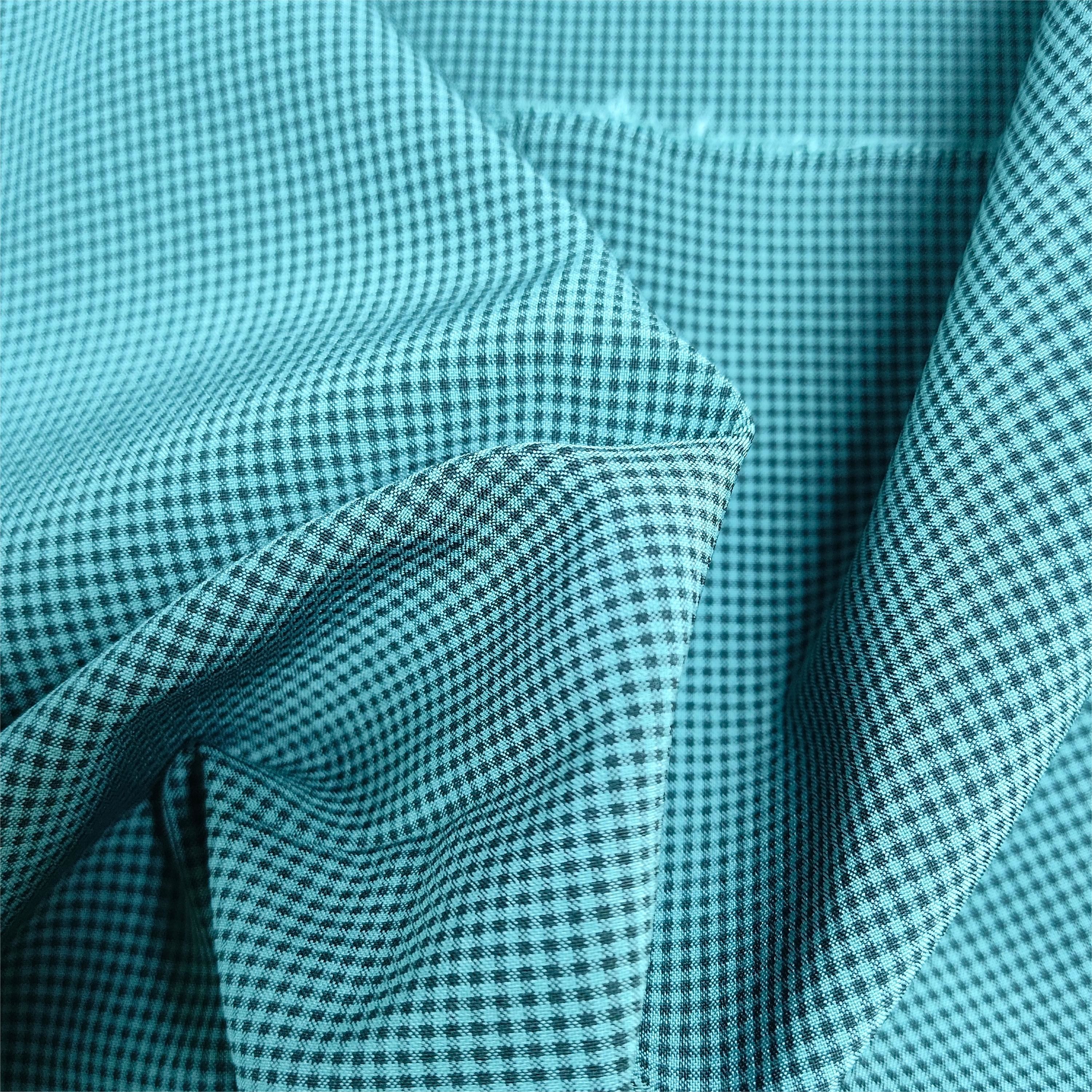 China 100D 140gsm Cationic Small Grid Four Sided Elastic Beach Pants Windbreaker Fabric wholesale
