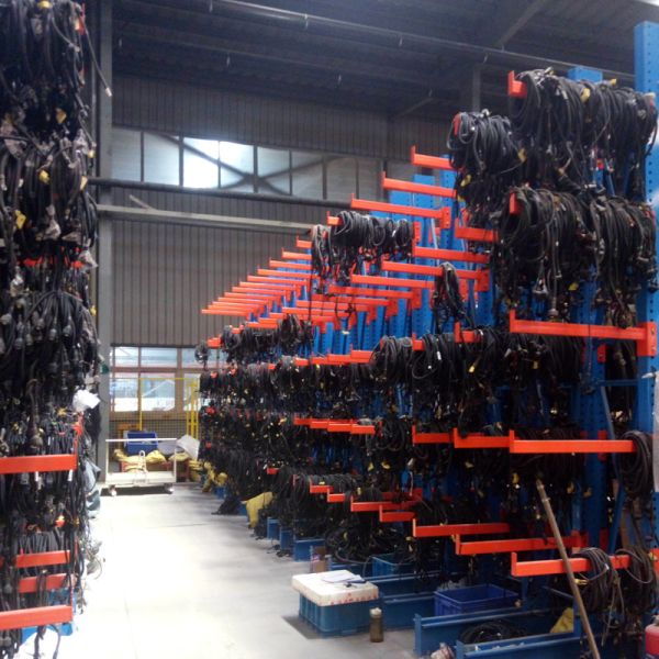 Cantilever rack system in industrial warehouse setting