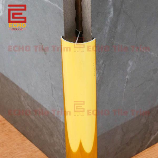 Aluminum gold tile trim installation example