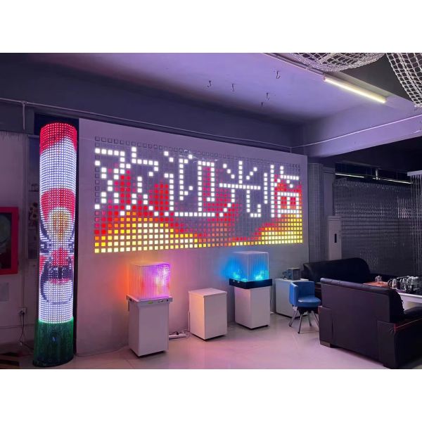 Outdoor landscape lighting on the exterior walls of the building colored LED grid screen